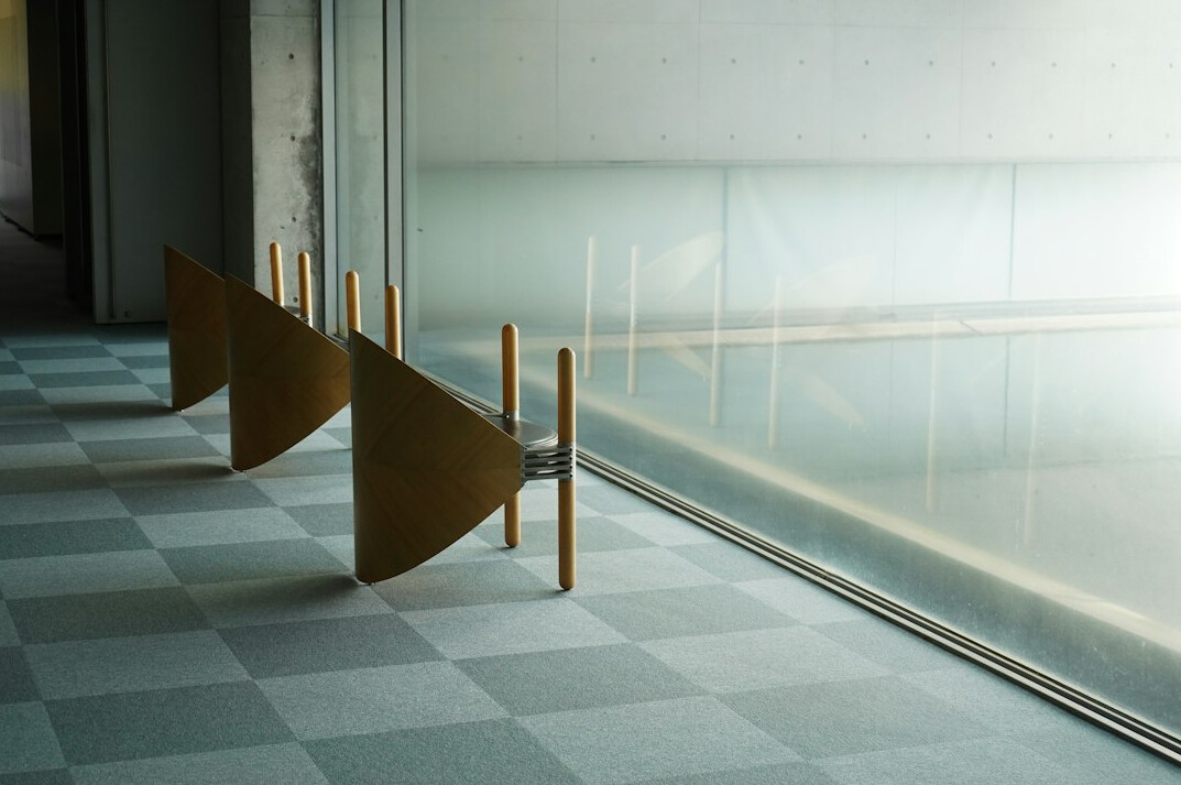 Quiet museum corridor with pale walls and soft light